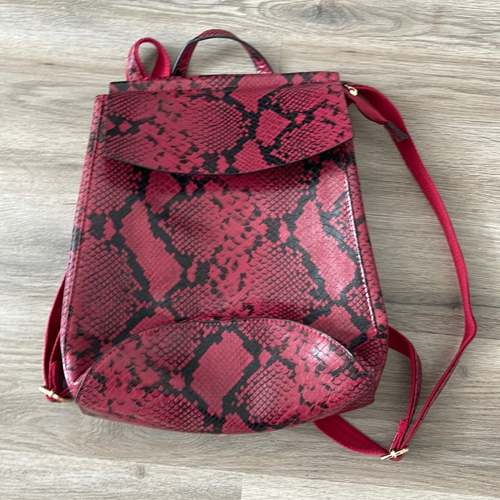 Red and black snakeskin backpack never been used.